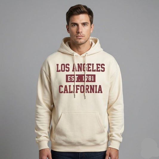Man wearing a beige hoodie with 'Los Angeles Est. 1781 California' text on a gray background