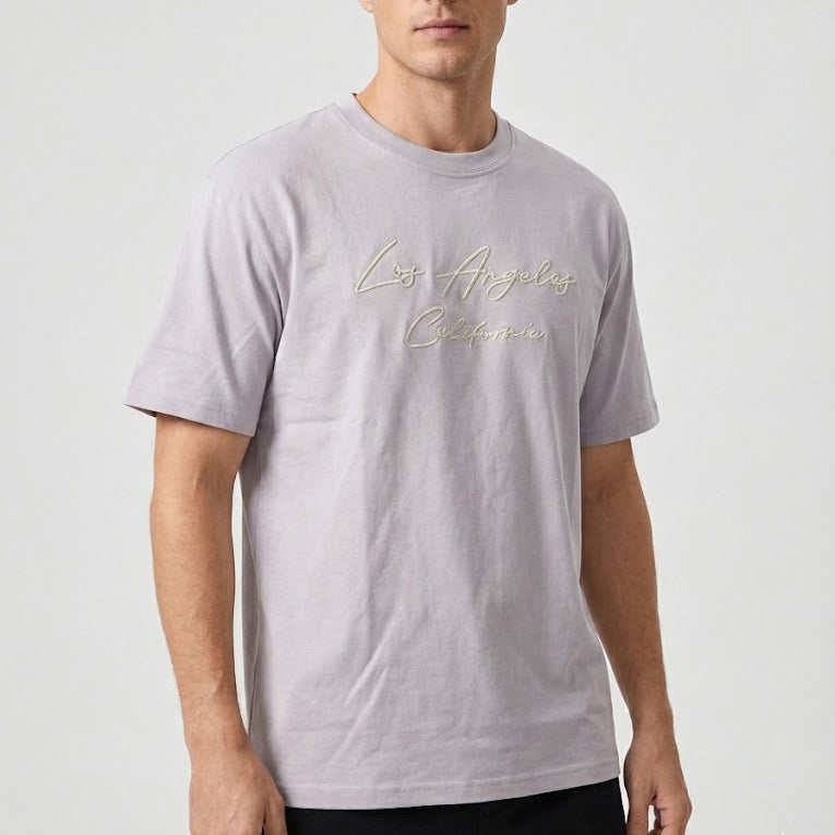 Man wearing a gray t-shirt with 'Los Angeles California' text on a white background
