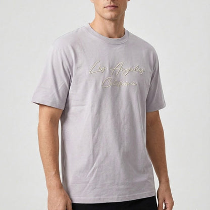 Man wearing a gray t-shirt with 'Los Angeles California' text on a white background